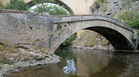 Old stone bridge over river La Cure in the Pierre-Perthuis, Burgundy, France Stock Footage 55388720