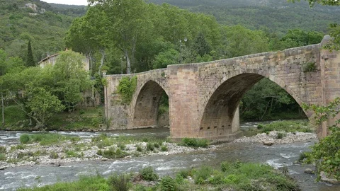 Old Stone Bridge Over a River in France Stock Footage 128812783