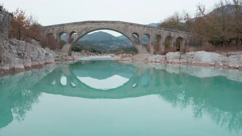Old stone bridge with river Stock Footage 239246020