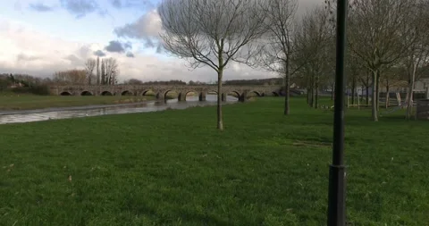 Old stone bridge &amp; river landscape in Normandy Stock Footage 235315763