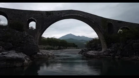Old Stone bridge spanning a serene river. Stock Footage 297850968