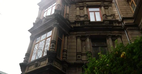 Old stone building after rainy day during fall season in germany, bottom view Stock Footage 230488865