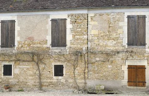Old stone building with shuttered windows, Nivernais Canal, Burgundy, France Stock Photos