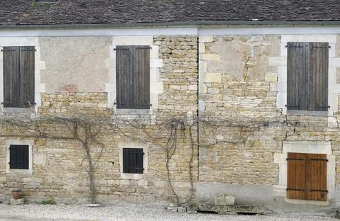 Old stone building with shuttered windows and vines, Nivernais Canal, Burgundy,  Stock Photos