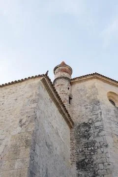 Old stone building with a small circular tower Stock Photos