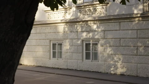 Old Stone Building Wall with Window Shadows in Afternoon Light Stock Footage 313220211