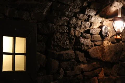 Old stone cellar with lamp Stock Photos