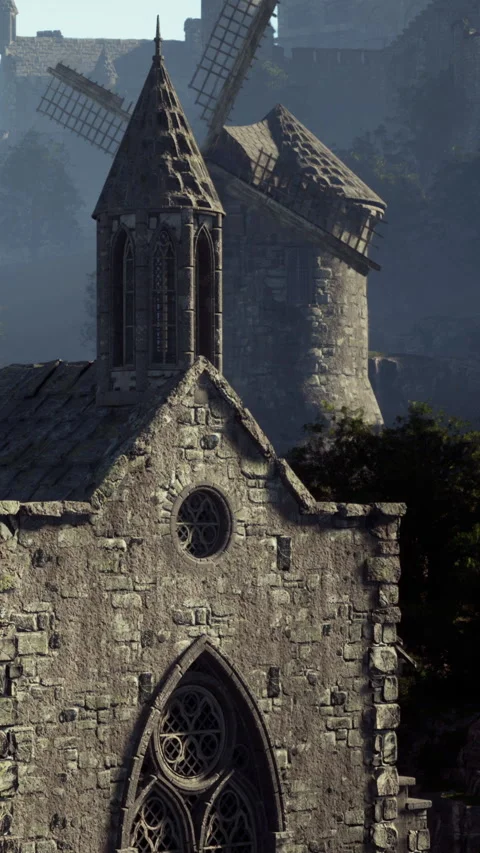 Old stone church and windmill in a scenic landscape under clear sky Stock Footage 337973828