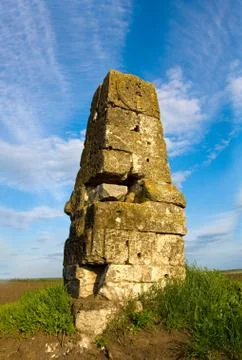 Old stone column in steppe Stock Photos
