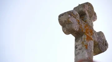 Old stone cross on top of chapel 4k Stock Footage 86000324