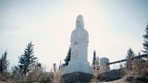 Old, Stone Grave Under the Autumn Sky and Surrounding Pines Stock Footage 90871573