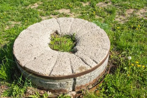 Old stone grinder. Stock Photos