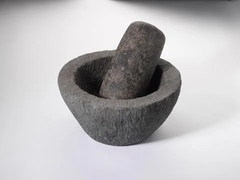 Old stone grinder on white background Stock Photos