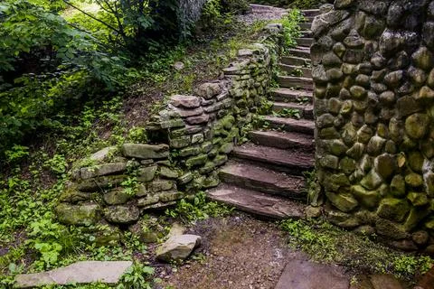 Old stone ladders in the forest Stock Photos