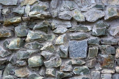 Old stone masonry. Background texture. Stock Photos