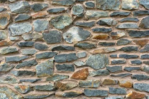 Old stone masonry. Background texture. Stock Photos