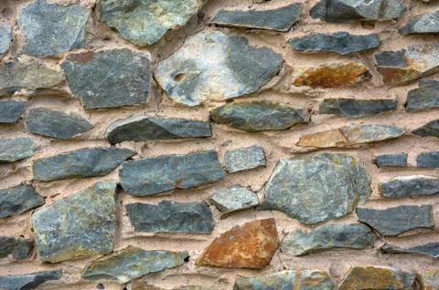 Old stone masonry. Background texture. Stock Photos