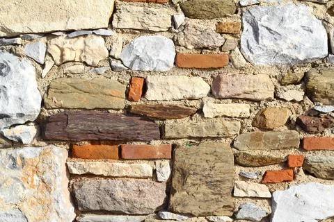 Old stone masonry wall texture background, banner with irregular pattern Stock Photos
