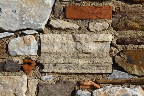 Old stone masonry wall texture background, banner with irregular pattern Stock Photos