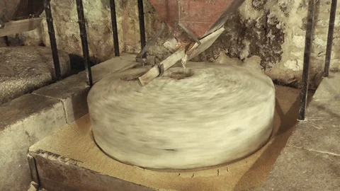 Old stone mill processing grains into flour Stock Footage 73536885