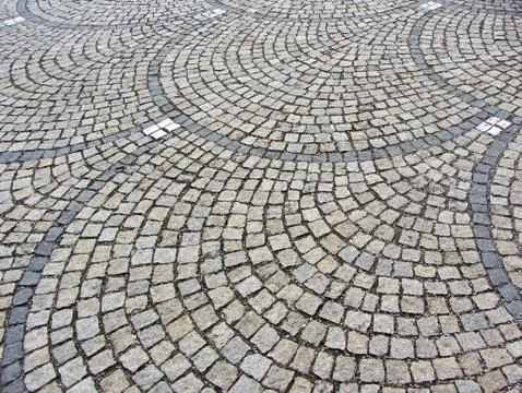 Old stone pavement in perspective. Stock Photos