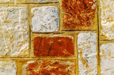 Old stone placed in the wall, interesting and original background Stock Photos