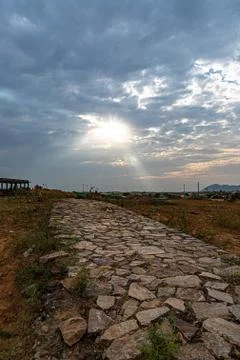 Old stone road and dramatic sky at pushkar camel festival. Stock Photos