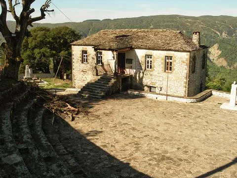 Old stone school in the shadow during the summer Stock Photos