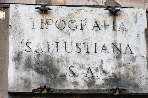 Old stone sign of Tipografia Sallustiana, Rome, Italy Stock Photos