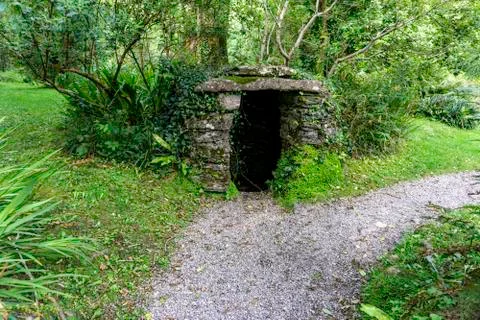 An old stone structure housing an old water well. Stock Photos