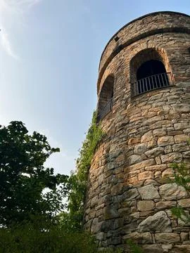 Old stone tower with arched windows Stock Photos