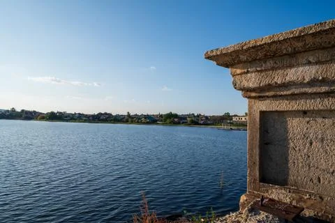 An old stone tower on the background of the harbor Foto stock