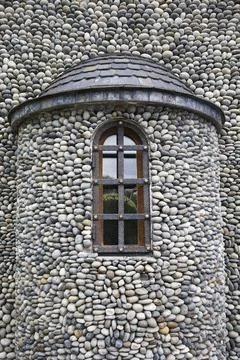 Old stone  wall and window with lattice . Alan women monastery exterior Stock Photos