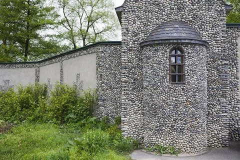 Old stone wall and window with lattice .  Convent exterior Stock Photos