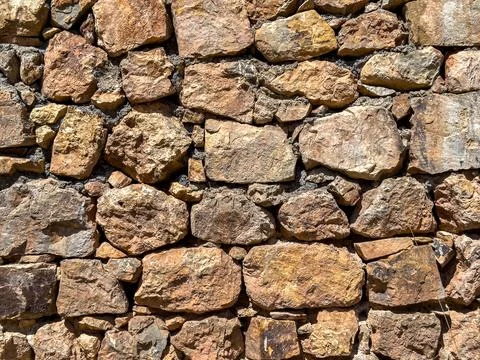 Old stone wall background. Ancient stonewall texture Stock Photos