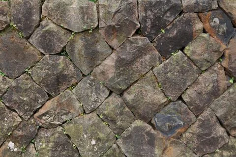 Old stone wall background. Part of a stone wall, for background or texture Stock Photos