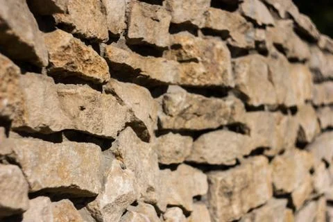 Old stone wall backgroung Angle shooted ancient wall Stock Photos