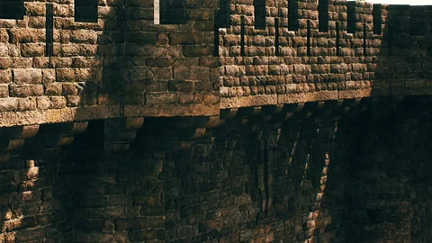 Old stone wall with battlements during sunny day in historic site Stock Footage 340628797