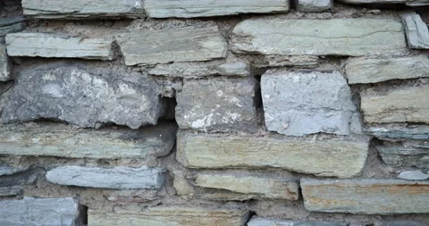 Old, Stone Wall in Closeup Reveals Detailed Texture Stock Footage 145883548