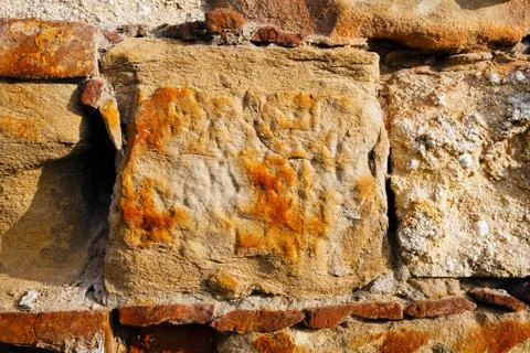 Old stone wall with graffiti Stock Photos