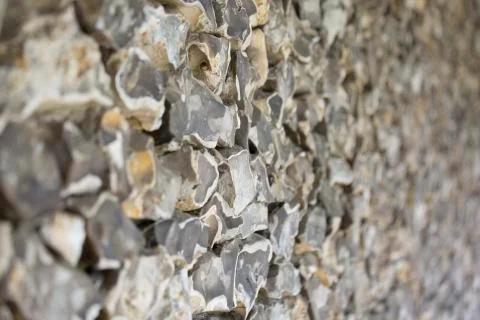Old stone wall made of flint Stock Photos