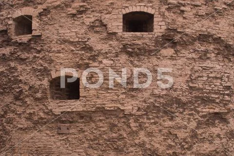 Old stone wall masonry texture background Stock Photos