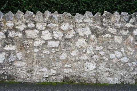 Old stone wall with moss. Stock Photos