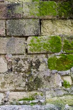 Old stone wall with moss texture background Stock-Fotos