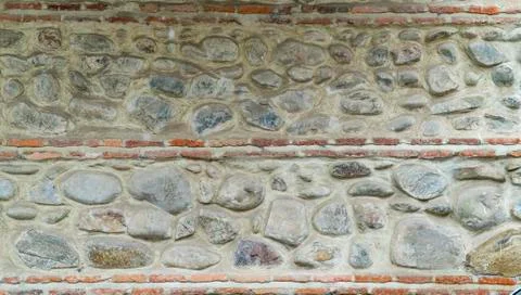 Old stone wall with a pattern Stock Photos