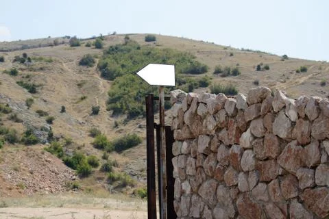 An old stone wall with a pointer Stock Photos