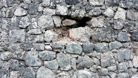 Old stone wall, rough texture of aged vintage ruin - ancient historical building Stock Footage 165342486