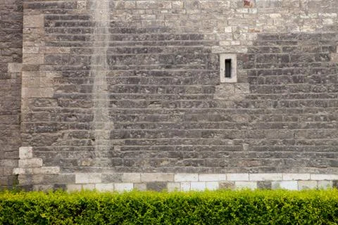 Old stone wall with small window Stock Photos