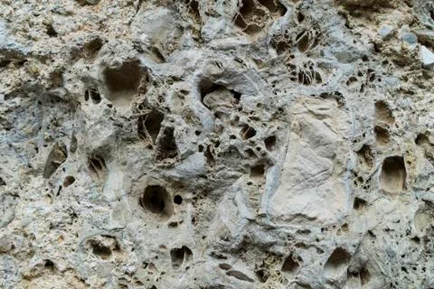Old Stone Wall Structure with Holes Stock Photos