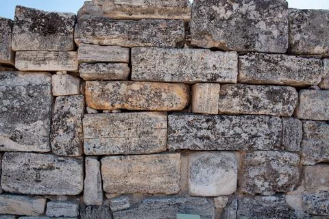 Old stone wall texture background. Rough stone wall. Big rough stones fence Stock Photos